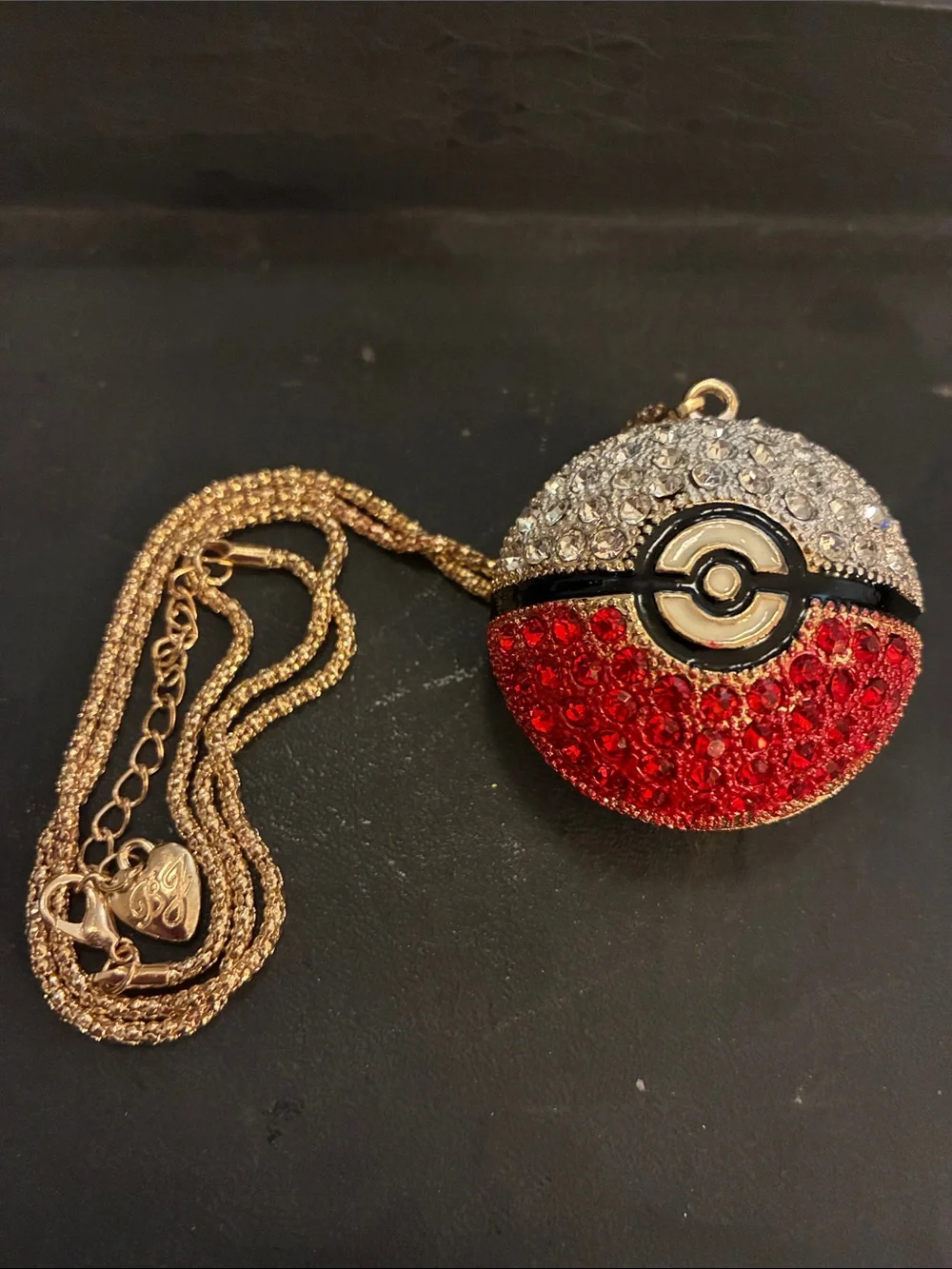 Crystal Poké Ball Red & Silver this pendant comes on a 17”chain with 3”extender.